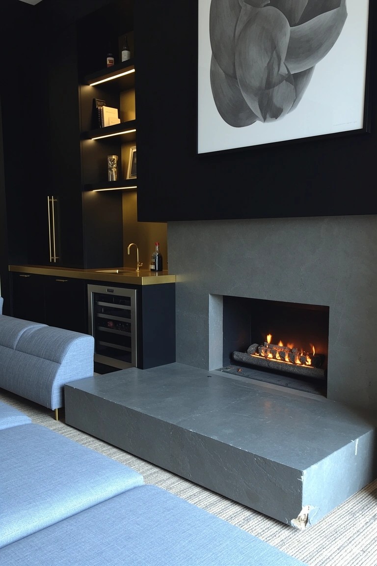 Moody speakeasy living room with black built-in bar, backlit shelves, gold accents, wine fridge, and low concrete fireplace platform with blue cushions
