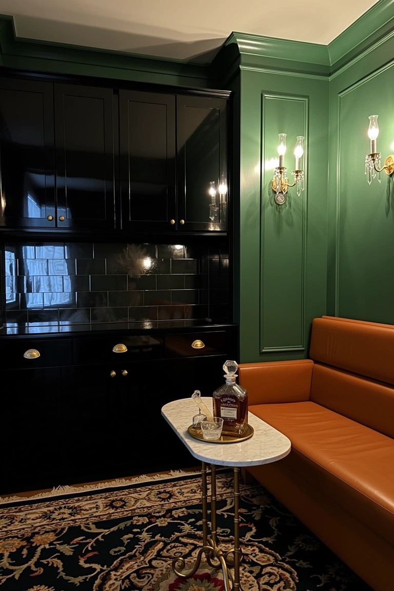 Tall black cabinet with glass doors as bar storage against dark green wall, orange leather bench nearby