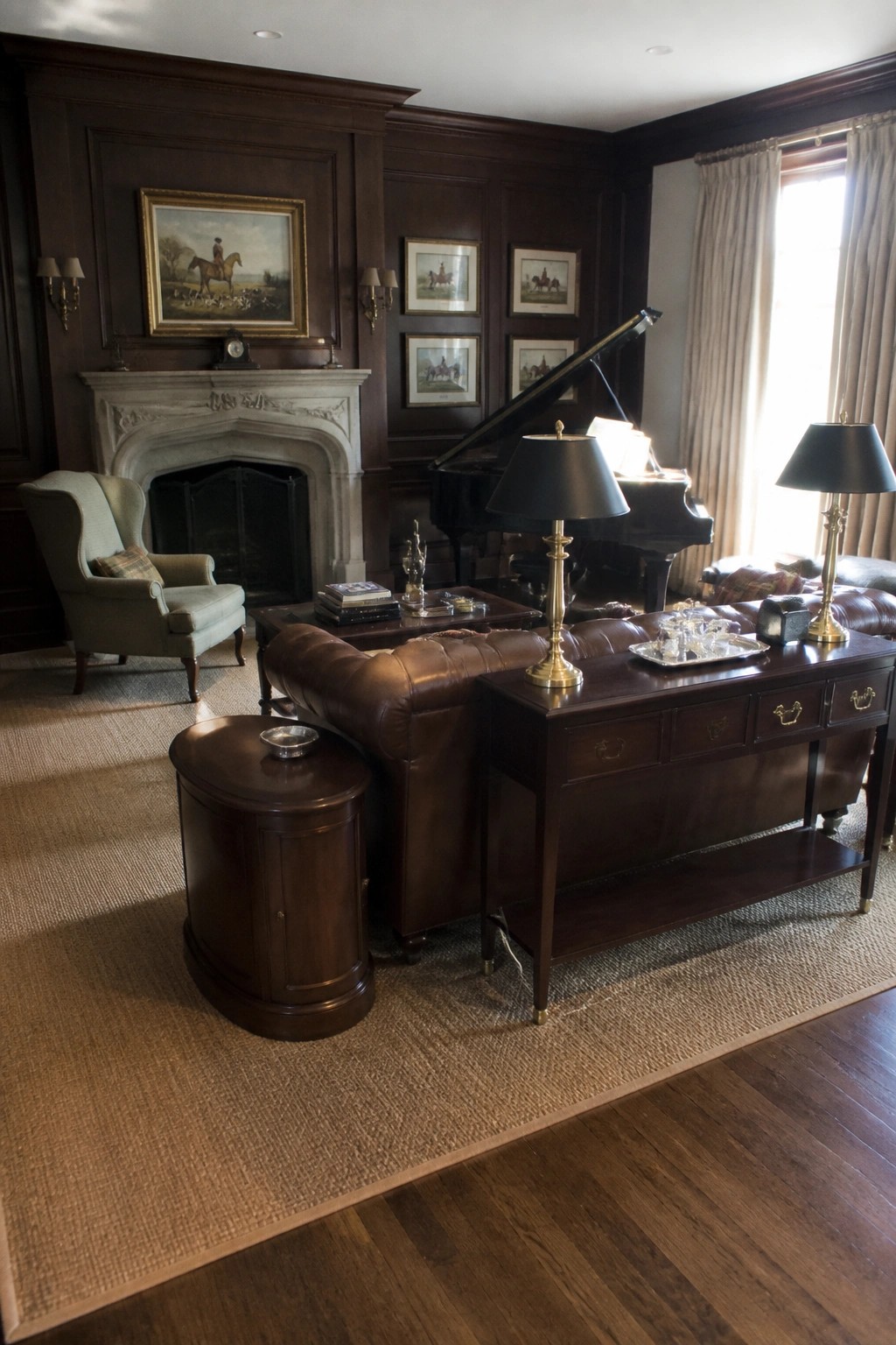 A traditional living room with dark wood paneling, a brown leather sofa, a grand piano, and a marble fireplace.