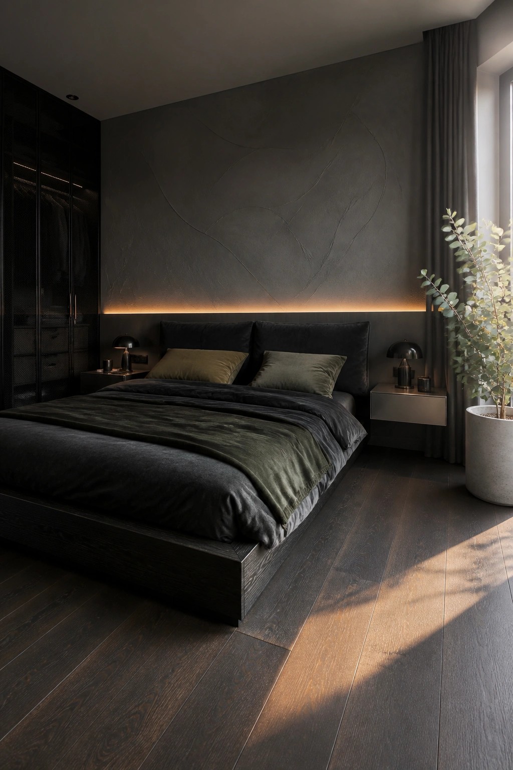 A modern bedroom featuring a large dark textured accent wall with integrated base lighting behind a low-profile bed dressed in dark bedding, with matching nightstands and a tall dark wardrobe on the left.