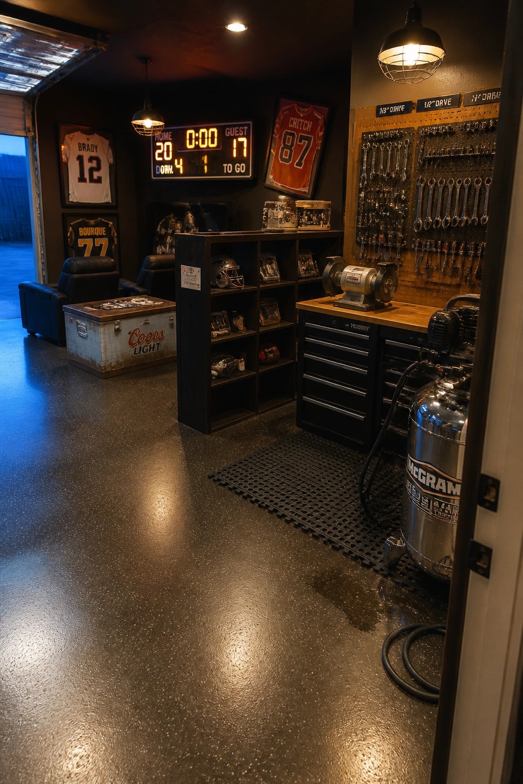 Organized garage with football jerseys, digital scoreboard, tool pegboard, workbench and air compressor.
