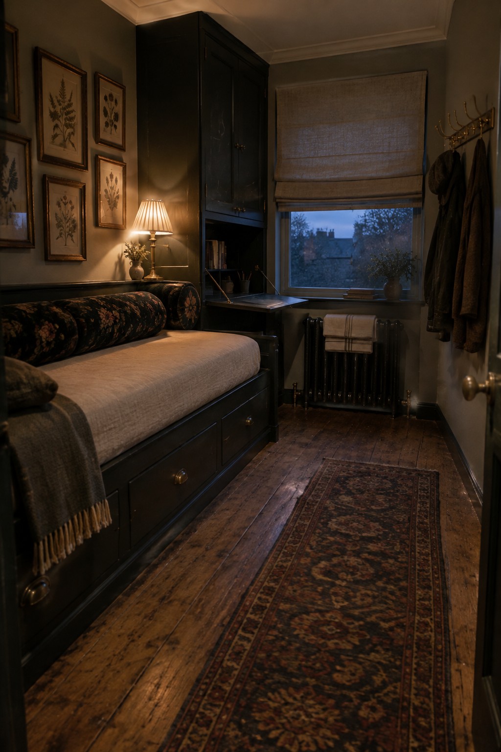 A narrow bedroom with a built-in daybed, drawers beneath the mattress, a wall cabinet, and a rug along the wooden floor.